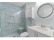 Inviting bathroom with a tiled glass shower, modern fixtures, and stylish vanity at 898 Abaco Path, The Villages, FL 32163