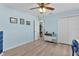 Cozy bedroom featuring a closet, ceiling fan, and ample room for flexible furniture arrangements at 898 Abaco Path, The Villages, FL 32163