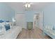 Comfortable bedroom featuring a daybed, closet and bench, creating a relaxing retreat at 898 Abaco Path, The Villages, FL 32163
