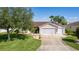Charming single Gathering home with a well-manicured lawn and a two-car garage at 898 Abaco Path, The Villages, FL 32163