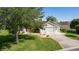 Charming single Gathering home with a well-manicured lawn and a two-car garage at 898 Abaco Path, The Villages, FL 32163