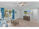 Comfortable living room with stylish couch, bright window, and fresh paint at 898 Abaco Path, The Villages, FL 32163