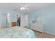 Comfortable bedroom with walk-in closet, ensuite bath, and soft blue walls at 898 Abaco Path, The Villages, FL 32163