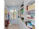 Spacious walk-in closet with custom shelves, providing plenty of storage at 898 Abaco Path, The Villages, FL 32163