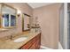 Bathroom showcasing granite counters, and a glass enclosed shower stall at 9023 Silver Lake Dr, Leesburg, FL 34788