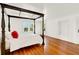 Bright and spacious bedroom features hardwood floors and ample natural light at 9023 Silver Lake Dr, Leesburg, FL 34788