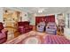 Comfortable living room featuring hardwood floors and plush seating at 9023 Silver Lake Dr, Leesburg, FL 34788