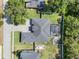 An aerial view of the landscaped property, pool, fire pit, and boat parking at 9518 Mid Summer Ln, Leesburg, FL 34788