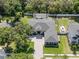 An aerial view of the landscaped property, pool, fire pit, and boat parking at 9518 Mid Summer Ln, Leesburg, FL 34788