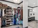 This large walk-in closet provides organization and houses a bathroom vanity at 9518 Mid Summer Ln, Leesburg, FL 34788