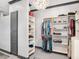 Spacious walk-in closet features custom shelving and ample storage at 9518 Mid Summer Ln, Leesburg, FL 34788
