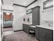 A luxurious main bathroom with dual vanities and neutral decor awaits your personal touch at 9518 Mid Summer Ln, Leesburg, FL 34788