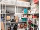 Organized pantry with white wire shelving filled with boxes and supplies for storage at 9518 Mid Summer Ln, Leesburg, FL 34788