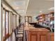 Upscale bar area with wood finishes and ample seating, perfect for social gatherings and relaxation at 453 Treviso Dr, Poinciana, FL 34759