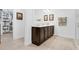 Bathroom features a double vanity with dark wood cabinets and a white countertop and tile floors at 453 Treviso Dr, Poinciana, FL 34759