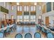 Spacious classroom with high ceilings, art supplies, colorful accents, and ample natural light at 453 Treviso Dr, Poinciana, FL 34759