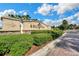 Stone community sign with manicured landscaping and clear blue sky at 453 Treviso Dr, Poinciana, FL 34759