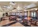 Elegant dining area with neatly arranged tables and chairs, ideal for community events and gatherings at 453 Treviso Dr, Poinciana, FL 34759