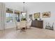 Bright dining area with ample natural light, comfortable seating, and stylish decor at 453 Treviso Dr, Poinciana, FL 34759