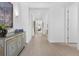 Bright hallway with tile flooring, elegant moldings, and neutral paint, leading to other rooms at 453 Treviso Dr, Poinciana, FL 34759