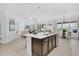 Open kitchen featuring an island with bar seating that adjoins the main living area at 453 Treviso Dr, Poinciana, FL 34759