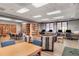 Bright community library space with books, tables, seating, and computers at 453 Treviso Dr, Poinciana, FL 34759