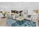 Open floor plan featuring a living room connected to the kitchen with a comfortable seating area at 453 Treviso Dr, Poinciana, FL 34759