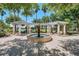 Picturesque outdoor fountain, offering a tranquil view with seating and beautiful landscaping at 453 Treviso Dr, Poinciana, FL 34759