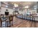 Upscale bar and restaurant with modern lighting, elegant decor, and comfortable seating at 453 Treviso Dr, Poinciana, FL 34759