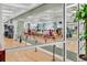 Bright and airy fitness studio with hardwood floors, mirrored walls, and plenty of space at 453 Treviso Dr, Poinciana, FL 34759