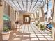 Inviting covered walkway featuring beautiful architecture and lush landscaping, offering a scenic path at 453 Treviso Dr, Poinciana, FL 34759