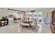 Open floorplan with dining area, island seating, and stainless appliances in kitchen at 1007 N Shore Dr, Leesburg, FL 34748