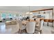 Open dining area featuring elegant seating and seamless connection to kitchen and living room at 1007 N Shore Dr, Leesburg, FL 34748