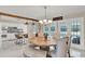 Open concept with dining area, seating for six, and bar seating at the kitchen island at 1007 N Shore Dr, Leesburg, FL 34748