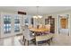 Dining room with views of the pool, and seating for six at 1007 N Shore Dr, Leesburg, FL 34748