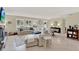Inviting living room with tile floors, fireplace, and a view of the home's entry at 1007 N Shore Dr, Leesburg, FL 34748