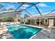 Large in-ground pool featuring a screened enclosure and outdoor entertaining area at 1007 N Shore Dr, Leesburg, FL 34748
