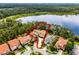Aerial view outlining waterfront home near a lake, surrounded by lush trees at 10122 Royal Island Ct, Orlando, FL 32836