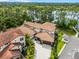 Breathtaking aerial view of an estate with lush landscaping, private dock, and luxurious details at 10122 Royal Island Ct, Orlando, FL 32836