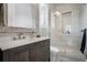 Modern bathroom featuring a glass-enclosed shower, a rustic vanity, and stylish tile work at 10122 Royal Island Ct, Orlando, FL 32836