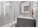 Bright bathroom with walk-in shower, single vanity, and modern decor at 10122 Royal Island Ct, Orlando, FL 32836