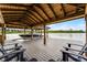 Covered boat dock features boat lift, ample space and lakeside views at 10122 Royal Island Ct, Orlando, FL 32836