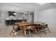 Chic dining area with a sleek, live-edge table and ample seating, great for hosting dinner parties and Gathering gatherings at 10122 Royal Island Ct, Orlando, FL 32836