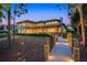 Beautiful waterfront home with a lighted wooden walkway and backyard featuring a spacious covered patio, perfect for outdoor entertaining at 10122 Royal Island Ct, Orlando, FL 32836