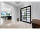 Foyer with an oversized black glass door leading to an open floor plan at 10122 Royal Island Ct, Orlando, FL 32836