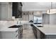 Modern kitchen with a large island, stainless steel appliances, and custom cabinetry, offering style and functionality at 10122 Royal Island Ct, Orlando, FL 32836