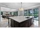 Large kitchen island with marble countertops and view of the water at 10122 Royal Island Ct, Orlando, FL 32836