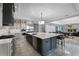 Modern kitchen featuring stainless steel appliances, a large island, and an open layout at 10122 Royal Island Ct, Orlando, FL 32836