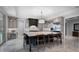 Contemporary kitchen featuring an oversized island with barstool seating and views into the adjacent backyard at 10122 Royal Island Ct, Orlando, FL 32836
