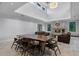 Open-concept living room and dining area with a stone fireplace and high ceilings at 10122 Royal Island Ct, Orlando, FL 32836